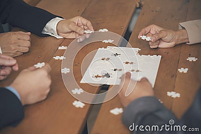 Implement improve puzzel solve connections together with synergy strategy team building organizing connection by trust Stock Photo