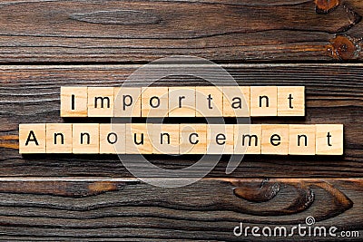 Important announcement word written on wood block. Important announcement text on wooden table for your desing, Top view concept Stock Photo