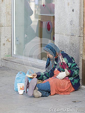 The impoverished and sick woman in Madrid Editorial Stock Photo