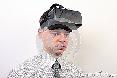 An impressed, dizzy, flabbergasted man wearing Oculus Rift VR virtual reality headset Editorial Stock Photo