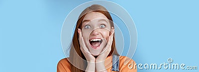 Impressed excited overwhelmed young redhead girlfriend fan screaming thrilled express afection adore awesome music band Stock Photo