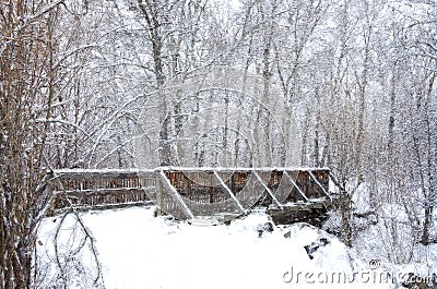 Impressionistic Style Artwork of a Snow Covered Bridge Winter Forest Stock Photo