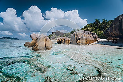 Impressive cloudscape above Anse Source D& x27;Argent tropical beach, La Digue Seychelles. Luxury exotic travel concept Stock Photo