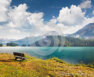 Impressive cloudy sky above Champfer lake in the Swiss Alps. Foggy summer scene of Switzerland, Alps, Europe. Traveling concept Stock Photo