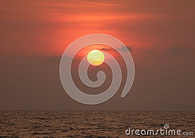 Impressive golden sun on red color gradation sky over gulf of Thailand Stock Photo