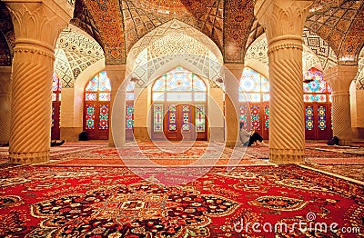 Impressive interior of Nasir ol Molk Mosque and resting people inside Editorial Stock Photo