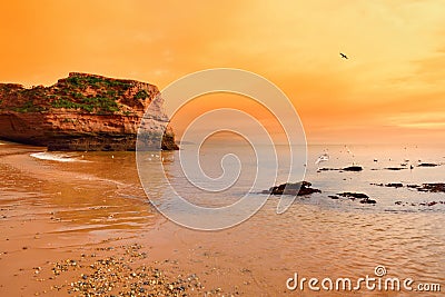 Impressive red sandstones of the Ladram bay on the Jurassic coast, a World Heritage Site on the English Channel coast of southern Stock Photo