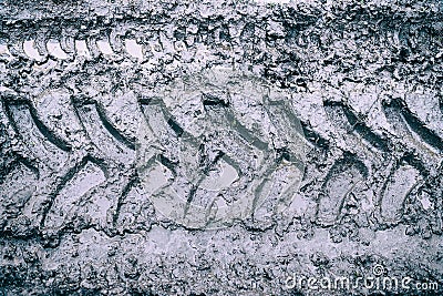 Imprint of an off-road vehicle tire on a dirty road Stock Photo