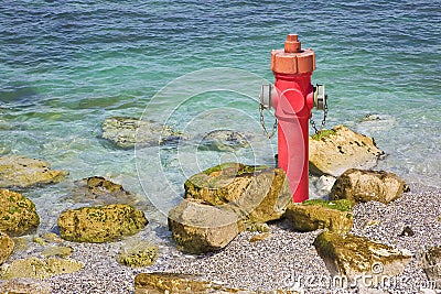 An improbable hydrant at the seaside - Plenty of water concept image Stock Photo