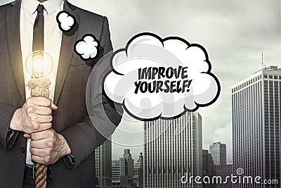 Improve yourself text on speech bubble with businessman Stock Photo