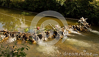 Improvised run-of-stream micro hydro electricity generation. , Laos Stock Photo