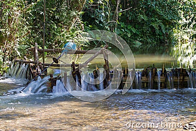 Improvised run-of-stream micro hydro electricity generation. , Laos Stock Photo