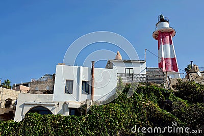 Inactive red and white striped lighthouse in Old Yaffo port Jaffa, Yafo, Tel Aviv, Israel,Middle East Stock Photo