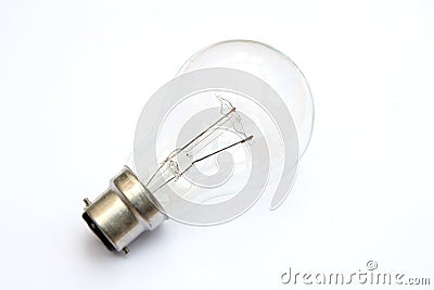 Incandescent tungsten clear B22 bayonet fitting light bulb on white Stock Photo