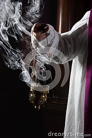 Incense burning in church Stock Photo
