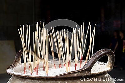Incense and incense burner relating to or believing in a religion Stock Photo