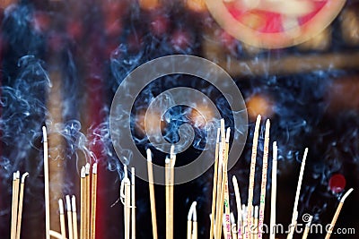 Incense left burning by worshipers at Wong Tai Sin Temple Stock Photo