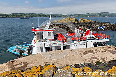 Launch ship moored at Inchcolm Island near Scottish Edinburgh Editorial Stock Photo