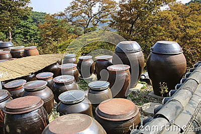 INCHEON, SOUTH KOREA - OCTOBER 21,2019: Dozens of large clay pots hold fermenting kimchi on the territory to Jeondeungsa Temple in Stock Photo