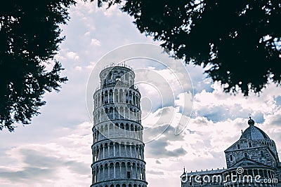 INCLINE Pisa tower from many different perspectives, duomo, blue sky with clouds, sun flare, wide angle photo, bottom and side vie Stock Photo