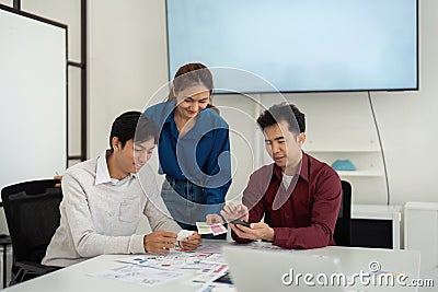 Collaborative UX UI Review Session. Designers evaluate concepts together, discussing the next steps for their projects. Stock Photo
