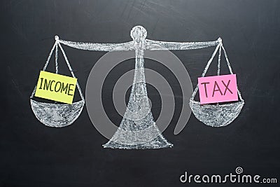 Income tax balance finance books scales concept Stock Photo