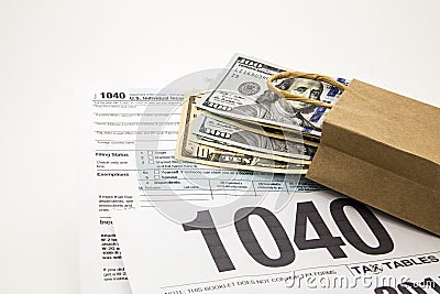 Income tax time forms irs 1040 cash bag money preparation Editorial Stock Photo