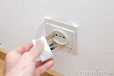 Incompatible electricity plug and socket Stock Photo