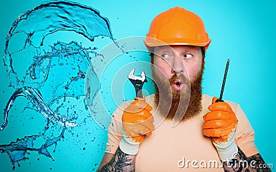 Incompetent worker plumber is unsure about his work. cyan background Stock Photo