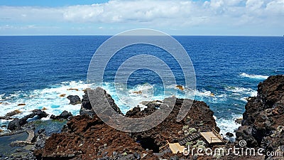 Inconspicuous entrance into secluded Charco Azul volcanic cave, El Hierro, Canary Islands, Spain Stock Photo