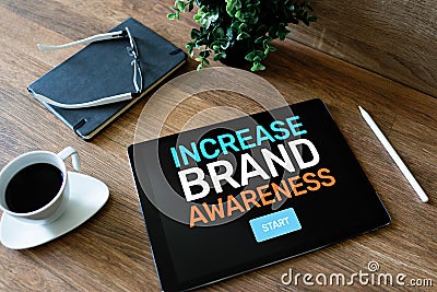 Increase brand awareness text on screen. Advertising and marketing concept. Stock Photo