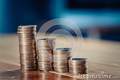 Increasing columns of coins, piles of gold coins arranged as a g Stock Photo