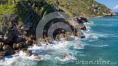 Incredible Aerial View of the Waves Breaking against the Rocks at Cormier Beach Haiti Stock Photo