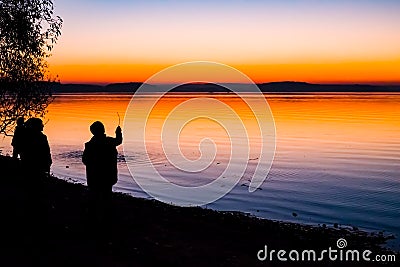 Incredible, bright sunset over the water. Stock Photo