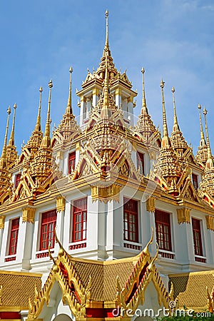Incredible Golden Spires of the Historic Loha Prasat Iron Castle inside Wat Ratchanatdaram Temple, Bangkok, Thailand Stock Photo