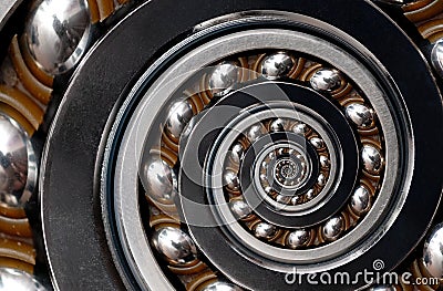 Incredible Industrial Spiral ellipse Ball Bearing rim. Spiral level bearing manufacturing technology. Unusual abstract texture fra Stock Photo