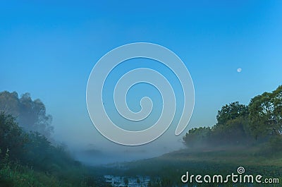 Incredible mist over the river at dawn. Night on the background of the moon and wildlife Stock Photo