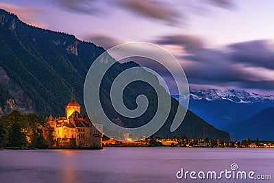 Incredible night scene with Chateau Chillon illuminated in twilight, Geneva Lake, Montreux, canton of Vaud, Switzerland Editorial Stock Photo