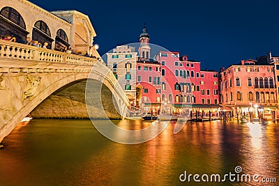 Incredible night scene of famous Canal Grande. Illuminated houses and Rialto Bridge. Fabulous summer cityscape of Venice, Italy, Stock Photo