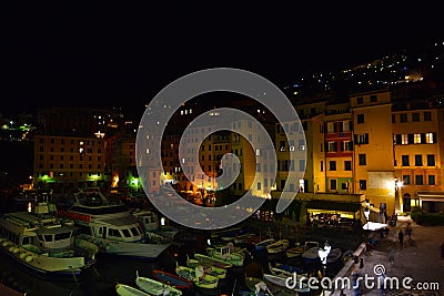 Incredible night view of the seaside town of Camogli with lights, colors and reflections in a magical atmosphere Editorial Stock Photo