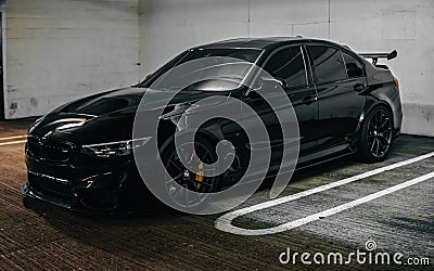 Incredibly amazing jaw dropping metallic black BMW M3 CS m power sports front car with angel lights Editorial Stock Photo