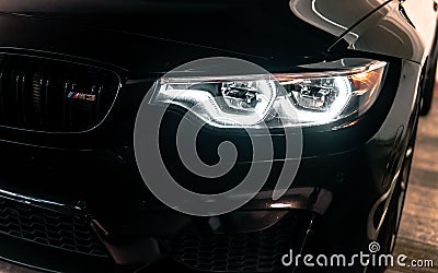 Incredibly amazing jaw dropping metallic black BMW M3 CS m power sports front car with angel lights Editorial Stock Photo