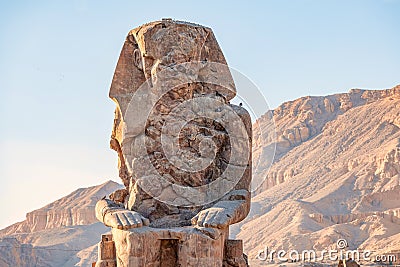 Incredibly magnificent and ancient statues of Colossi on the west bank of the Nile. Colossi Memnon Stock Photo