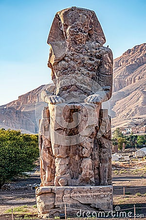 Incredibly magnificent and ancient statues of Colossi on the west bank of the Nile. Colossi Memnon Stock Photo