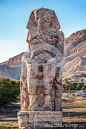 Incredibly magnificent and ancient statues of Colossi on the west bank of the Nile. Colossi Memnon Stock Photo