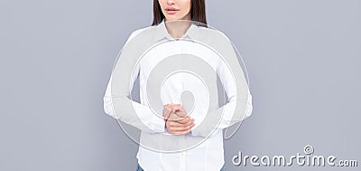 indecisive businesswoman in white shirt on grey background, ceo Stock Photo