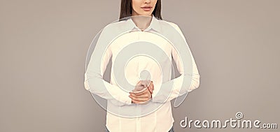 indecisive businesswoman in white shirt on grey background, ceo Stock Photo