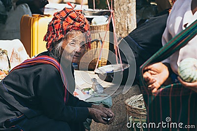 Indein, Myanmar - March 2019: old Burmese woman from PaO dragon people tribe on the street market at Inle lake Editorial Stock Photo