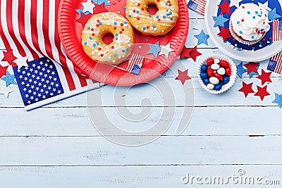 Independence Day background on 4th of July with american flag, stars and food on wooden table top view. Stock Photo