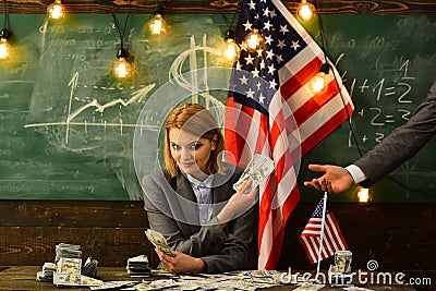 Independence day of usa. Income planning of budget increase policy. Woman with dollar money for bribe. Corruption Stock Photo